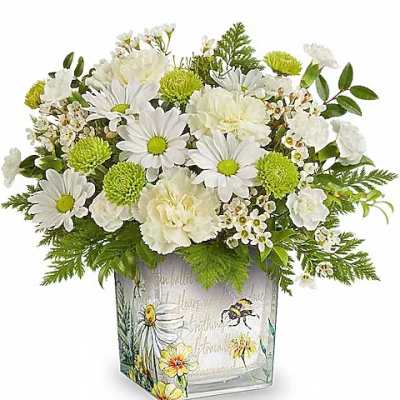 White daisies and carnations in a decorative square vase