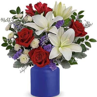 Red roses and white lilies in a blue vase