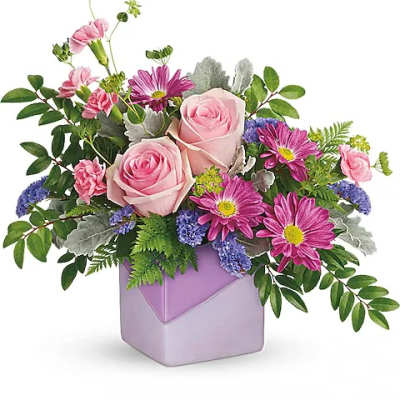 Pink roses and purple daisies in a lavender vase