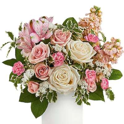 Pink and white rose bouquet in a white vase