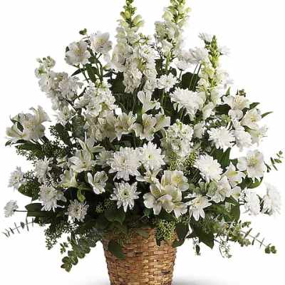 White floral arrangement in a woven basket