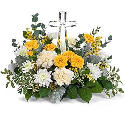 Yellow and white floral arrangement with a clear cross centerpiece