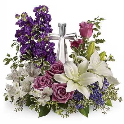 Purple and white floral arrangement with roses and lilies around a silver ribbon