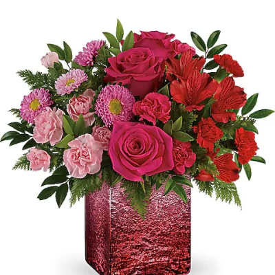 Pink and red rose bouquet in a glittery red vase