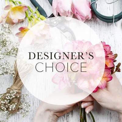 Pink and white floral bouquet with a circular "Designer’s Choice" overlay