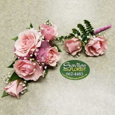 Pink rose corsage and boutonniere with baby's breath