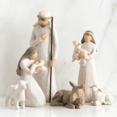 Nativity figurines of Mary, Joseph, baby Jesus, and sheep
