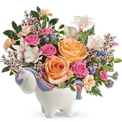 Bouquet of mixed flowers in a unicorn-shaped ceramic vase
