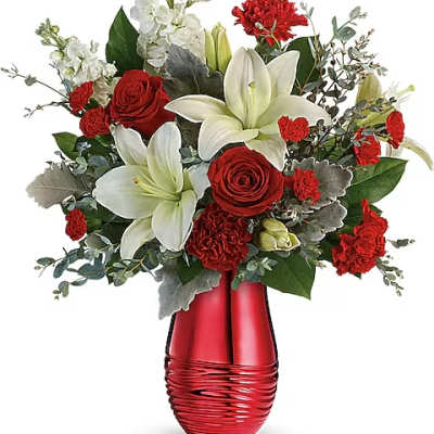 Red roses and white lilies in a red vase