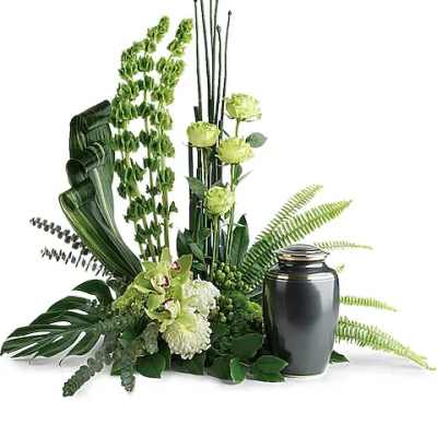Green floral urn arrangement with orchids and ferns beside a dark urn