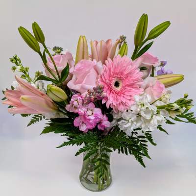 Pink and white mixed bouquet in a clear glass vase