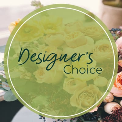 Designer’s Choice text over a floral arrangement background