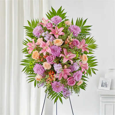 Pink and lavender floral standing spray on an easel
