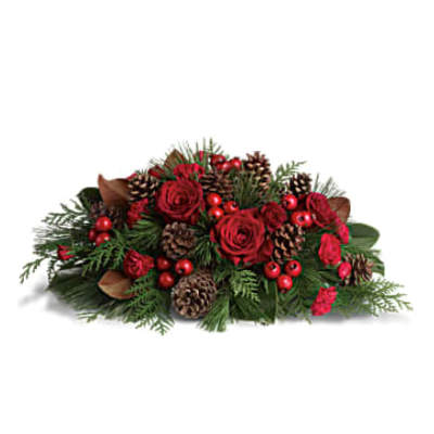 Low red rose and evergreen centerpiece with pinecones and red berries