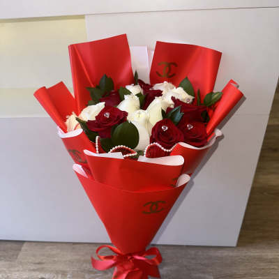 Beautiful Chanel bouquet, red and white roses, pearl tulle, red Chanel paper, each rose has its diamond