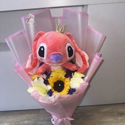 Pink plush toy bouquet with sunflowers and white roses in pink wrap