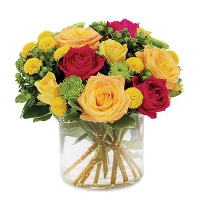 Bouquet of yellow and pink roses in a clear glass vase