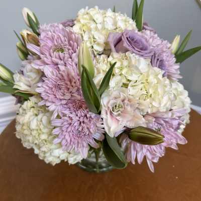 Bouquet of lavender and white flowers in a glass vase