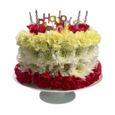 Tiered cake made of red, white, and yellow flowers with birthday candles