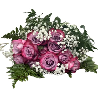 Pink and lavender roses with white baby's breath and fern foliage