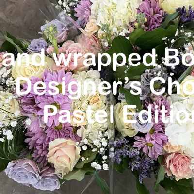 Hand wrapped pastel bouquet with roses, hydrangeas, and daisies