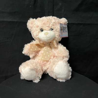 Plush teddy bear with a polka-dot ribbon bow