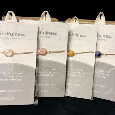 Packaged gemstone bracelets on display cards