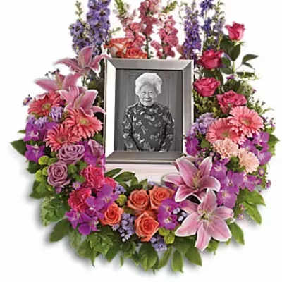 Floral photo frame wreath with pink, purple, and orange flowers