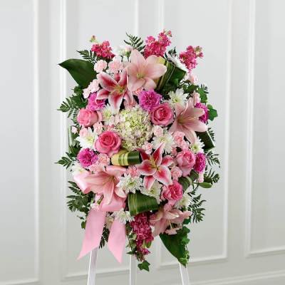 Pink and white floral standing spray with lilies and roses