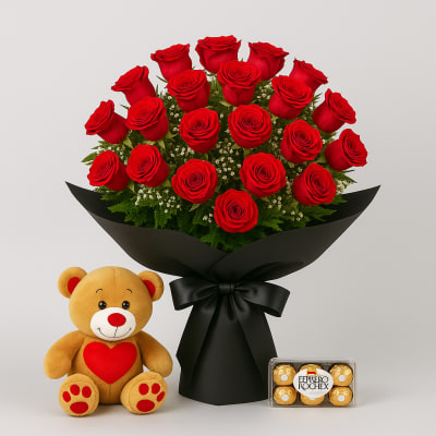 Bouquet of red roses with a teddy bear and a box of chocolates