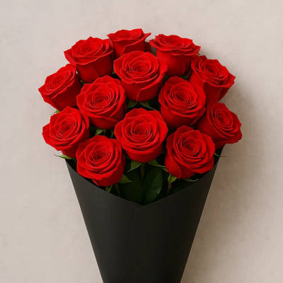 Bouquet of red roses wrapped in black paper with a black ribbon