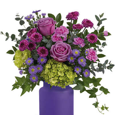 Bouquet of pink and purple flowers in a purple vase
