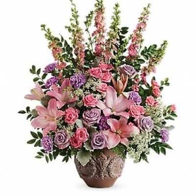 Pink and lavender floral arrangement in a decorative vase