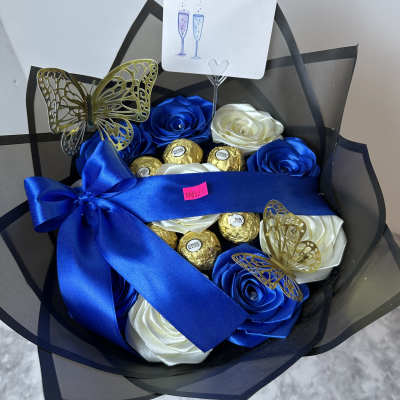 Blue and white satin rose bouquet with chocolates and a champagne card