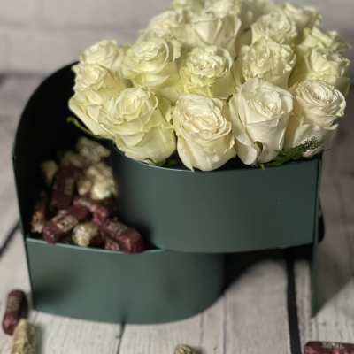Cream rose bouquet in a dark green box with chocolates
