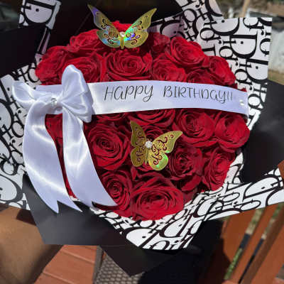 Red rose bouquet with a Happy Birthday ribbon and white bow
