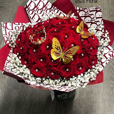 Red rose bouquet with white baby's breath and gold butterfly accents