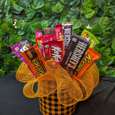 Candy bouquet in a checkered box with orange mesh ribbon