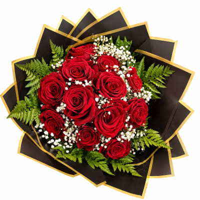 Bouquet of red roses with white baby's breath and fern foliage