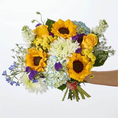 Handheld bouquet with sunflowers, yellow roses, hydrangeas, and white chrysanthemums