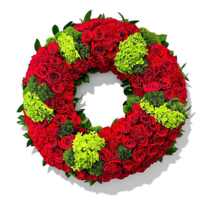 Circular wreath of red roses and lime-green flowers