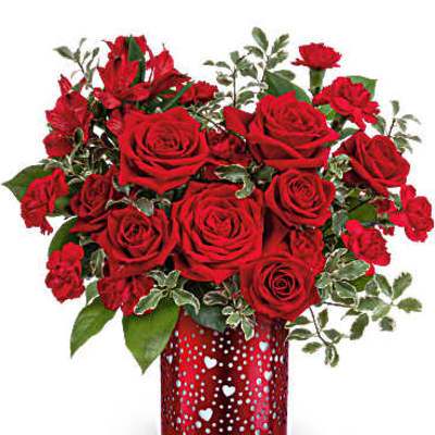 Red roses and carnations in a red heart-patterned vase