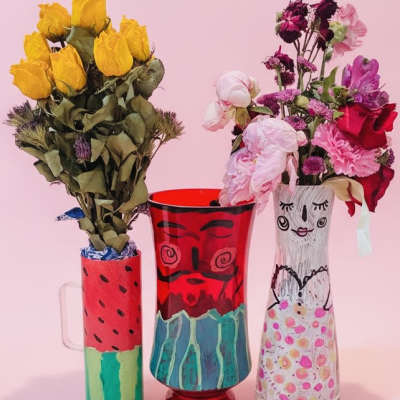 Painted pairs "Mamasita with macho melon man" vases w/a gift bouquet inside