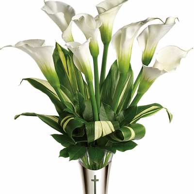White calla lilies arranged in a tall vase with a cross emblem