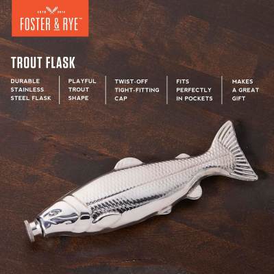 Fish-shaped stainless steel flask on a dark wood surface