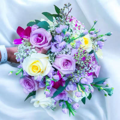 Handheld bouquet of lavender and white roses with purple orchids