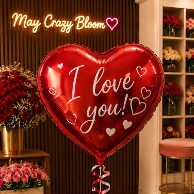 Red heart balloon with "I love you!" text in a flower shop