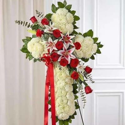 Standing floral spray with red roses, white lilies, and white mums