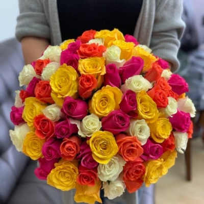 Large bouquet of multicolored roses in pink, yellow, orange, and white