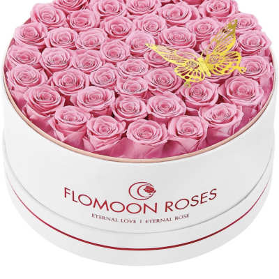Round box of pink roses with a yellow butterfly topper